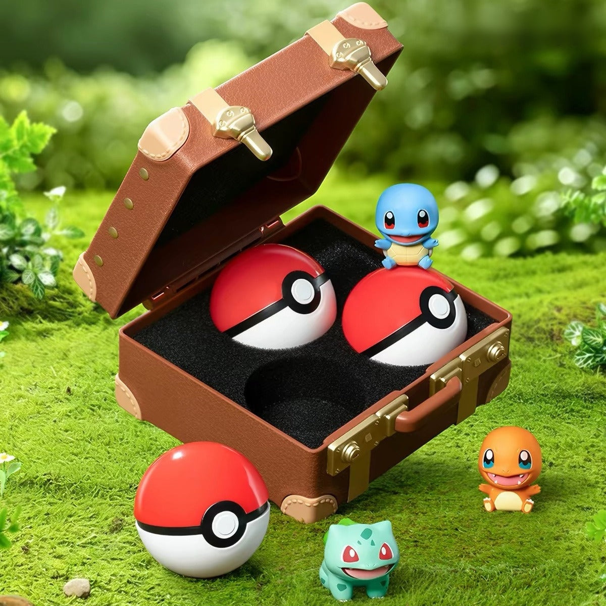 Pokemon first partner figures with Poke Ball capsules and a suitcase display case